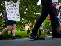 Pro-choice protesters march past Chief Justice John Roberts’ house in Chevy Chase, MD.  Police and federal marshals are currently protecting...