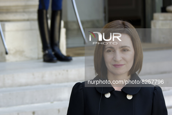 Moldova's President Maia Sandu listens the welcome speech of the France's President Emmanuel Macron at the presidential Elysee Palace in Par...