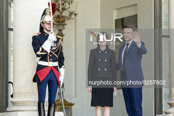 Moldova's President Maia Sandu (L) and France's President Emmanuel Macron (R) at the entrance of presidential Elysee Palace in Paris - May 1...