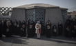 Iranian veiled women hold portraits of the Islamic Revolutionary Guard Corps’ (IRGC) colon...
