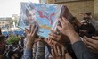 Iranian mourners carrying the coffin containing the body of the Islamic Revolutionary Guar...