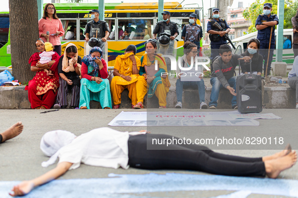 Nepalese youth performs a play while protesting against caste system and justices for six men from lower caste who were  killed  by vicious...