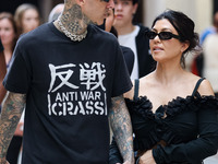 Kourtney Kardashian and Travis Barker are seen at Piazza Duomo on May 26, 2022 in Milan, Italy (