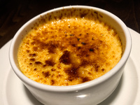 Creme brulee dessert is seen at a restaurant table in this illustration photo taken in Krakow, Poland on May 22, 2022. (