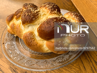 Braided bread called Chalka is seen on a restaurant's table in Krakow, Poland on May 24, 2022. (