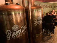 Pilsner Urquell logo is seen on beer vat in restaurant in Krakow, Poland on May 24, 2022. (