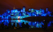 People watch mapping with music while being screened on the Wawel Castle to celebrate the...