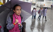 A Palestinian schoolgirl hold an umbrella as they go to school on a rainy day in  Gaza Cit...