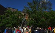 The view of the Wawel Dragon monument (Polish: Smok Wawelski) crowded with many tourists....