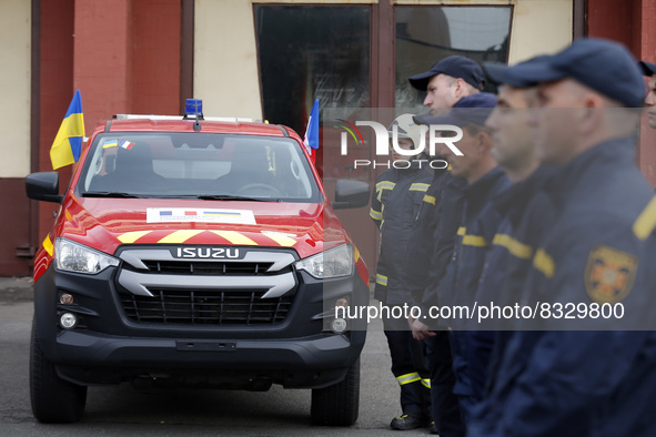 KYIV, UKRAINE - MAY 30, 2022 - Rescuers are pictured next to the firefighting and other special vehicles handed over for the needs of the SE...