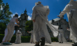 Members of the Pauline Fathers commune in Krakow and their friends dancing in the courtyar...