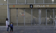 A woman and a minor wait for public transport after concessioned transport workers in Mexi...