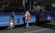 A public transport user on foot while drivers block several roads in Mexico City to demand...