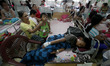Children stricken with dengue disease crowd a ward inside a hospital in Quezon City, the P...