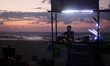 A Palestinian vendor sells grilled corn during the sunset at the beach of Gaza city on Oct...