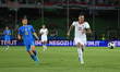 Hungary's Dominik Szoboszlai hindered by Italy's Nicolo Barella during the football UEFA N...