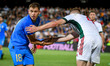 Italy's Nicolo Barella helps Hungary's Attila Szalai during the football UEFA Nations Leag...