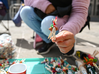 June 16, 2022, Toluca, Mexico: Craftswomen offers their different palm products outside of the Toluca's Cathedral on the occasion of the Cor...