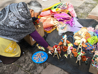 June 16, 2022, Toluca, Mexico: Craftswomen offers their different palm products outside of the Toluca's Cathedral on the occasion of the Cor...