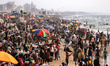 Hundreds of Palestinian people gather in Gaza Beach to cool off on a hot day during the su...