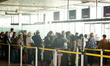 Travellers are seen waiting for check in at Eurowings check in counter at Cologne & Bonn a...