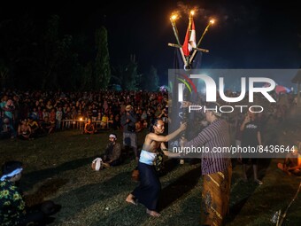 Villagers leaders prepare a ritual prior to playing fire football, known locally as "sepak bola api", a fireball made from a coconut from a...