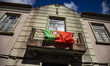 A Portuguese flag fly hanging on a balcony in Aveiro, Portugal on June 22, 2022. 