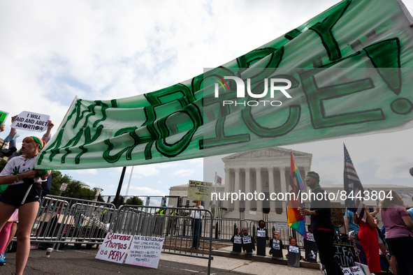 A pro-choice banner is displayed at the Supreme Court after it issued its opinion on Dobbs v. JWHO.  The opinion reverses the federal right...