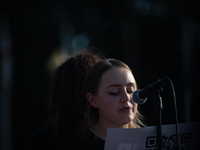 I protester at the Bans Off Our Bodies rally at Union Station nearthe  U.S. Supreme Court in Washington, D.C. reads her testimony of sexual...