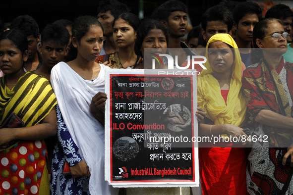 Garment workers take part in a rally in front of press club organized by United Federation of Garment Workers in Dhaka demanding compensatio...