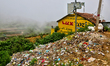 Large pile of garbage alongside farmland in the Poombarai Village in Kodaikanal, Tamil Nad...