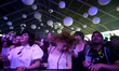 Festival goers cheer during the concert of US band Modest Mouse during the first day of th...