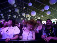 Festival goers cheer during the concert of US band Modest Mouse during the first day of the NOS Alive 2022 music festival in Lisbon, Portuga...