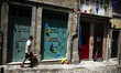 Decorations for the Sao Joao celebrations hang between houses in the city center of Porto,...