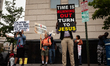 Counter-protesters at a direct action by the Women's March urge people to seek Jesus.  The...