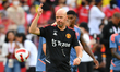 Manchester United's manager Erik Ten Hag [R] in action during the training session before...