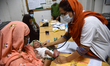  A doctor checks a child patient inside the Dhaka Children's Hospital in Dhaka, Bangladesh...