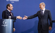 German Chancellor Olaf Scholz (R) and Egyptian President Abdel Fattah el-Sisi (L) shake ha...