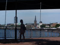 A woman's silhouettes of walking along the Rhine river in the mid of day in Duesseldorf, Germany on July 18, 2022 as a heat wave reaches to...