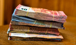 Bills of 5, 10, 20, 50 euros piled up. Illustration pictures of bills and coins in euro. C...