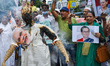 Activist of Indian National Congress is seen burning an effigy of Narendra Modi during a p...