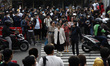 A group of woman walking on a zebra cross that is used as a catwalk around the dukuh Atas...