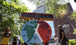 Demonstrators rally with signs near the Climate Clock in Union Square on July, 22, 2022 in...