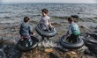Children play in the waves with rubber rings purchased in case of emergency on the sea, in...