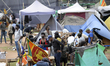 Protesters dismantle their tents subsequent to a police order to leave Gota Go Gama camp,...