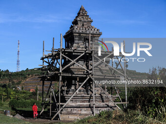A tourist looking at Setiaku temple of the Dieng mountain area in Banjarnegara, Central Java province, Indonesia, August 6, 2022. (