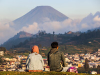 Tourists enjoy a view of the Dieng mountain area in Banjarnegara, Central Java province, Indonesia, on August 6, 2022. (