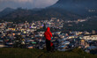A tourist enjoys a view of the Dieng mountain area in Banjarnegara, Central Java province,...