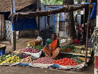 Woman selling fruits and vegetables along the roadside in Nilakkottai (Nilakottai), Tamil Nadu, India, on May 18, 2022.  (