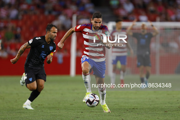 Antonio Puertas, of Granada CF  scores a goal during the City of Granada Trophy match between Granada CF and Malaga CF at Nuevo Los Carmenes...